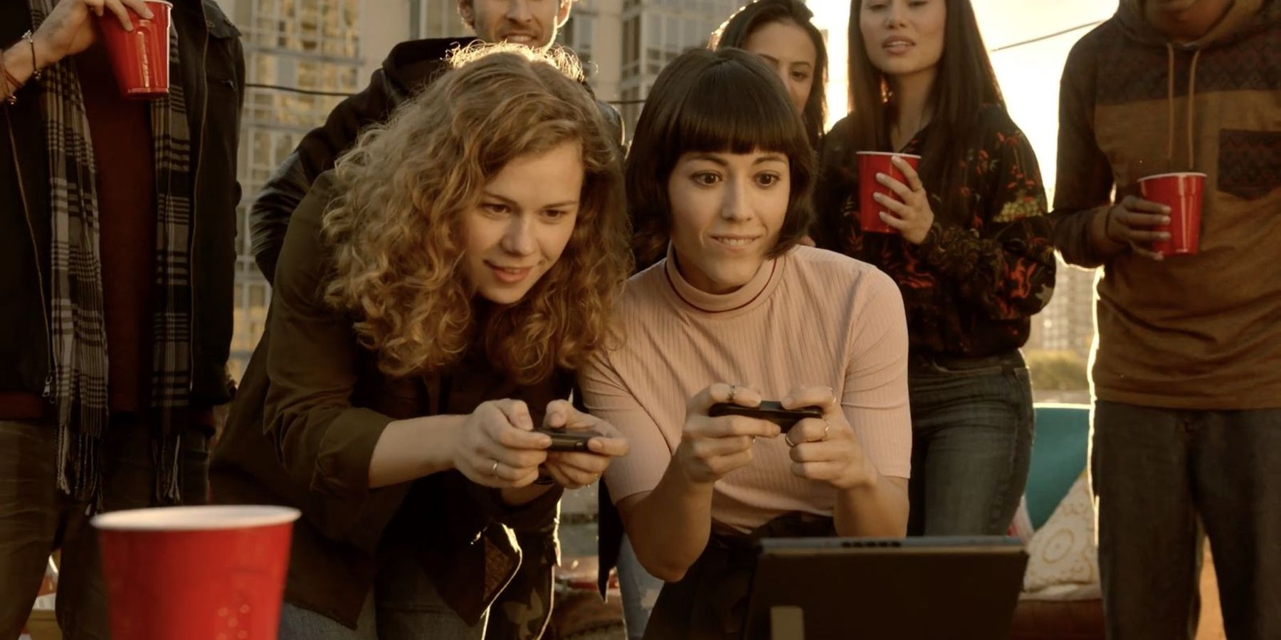 switch tv advertisement with people playing at a cool rooftop party